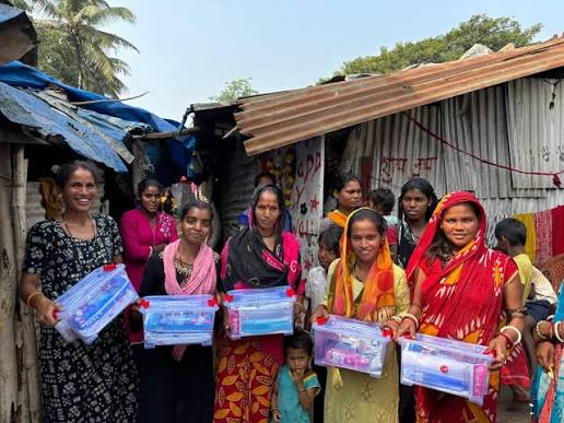 Women receiving hygiene kits at a Kindpath distribution drive